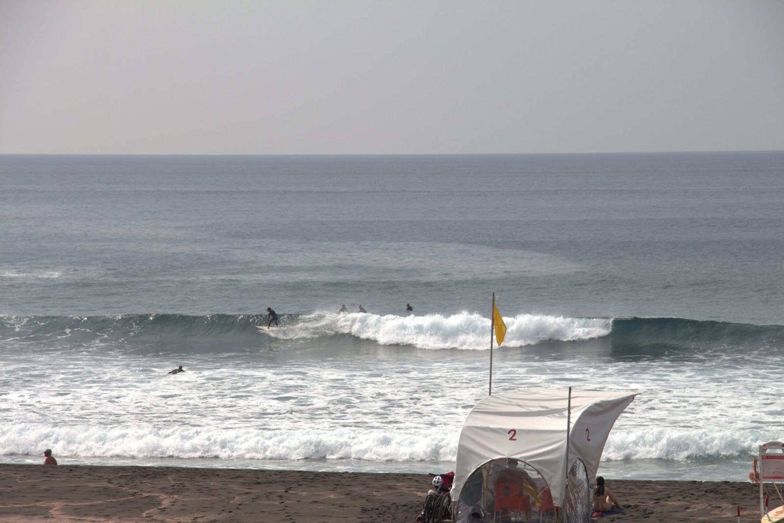 a local surfer on a wave in the Azores