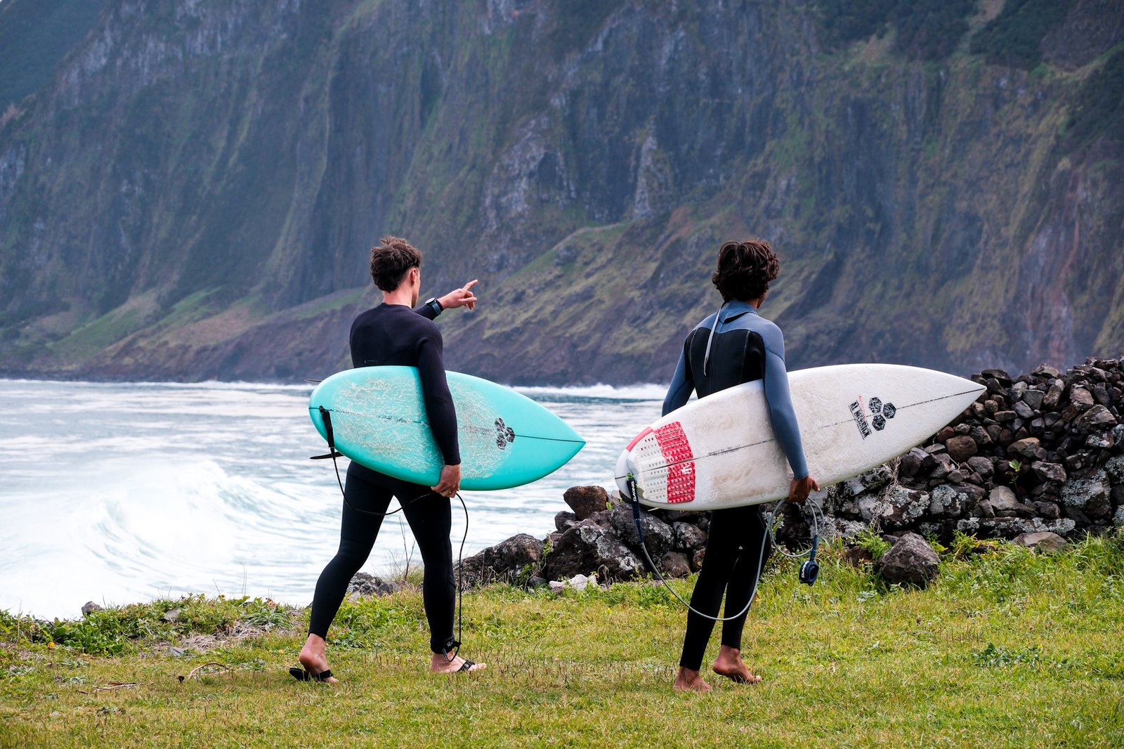 A surfer talking about the spot with his surf guide